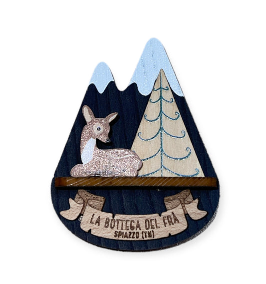 Calamita in legno cima innevata